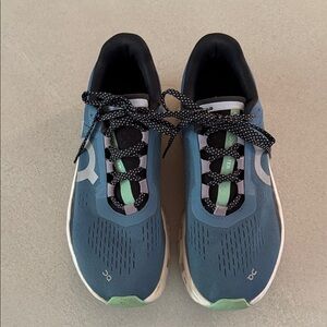 On Running Blue and Green Athletic Shoes